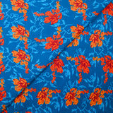 Cotton poplin printed stylized flower orange turquoise background