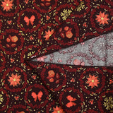 Popeline de coton imprimée poinsettias et nœuds orange fond marron