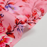 Cotton poplin printed with romantic coral pink background