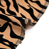 Flocked wool blend zebra black velvet camel background