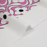 Black floral printed viscose with pink background