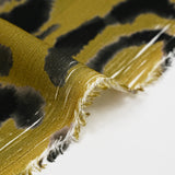 Printed viscose crepe with blotter effect, khaki background