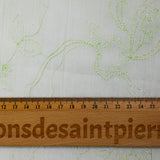 Crumpled polycotton and embroidered anise green flowers
