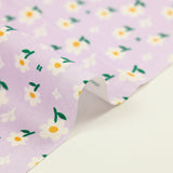 White daisy printed cotton poplin with purple background