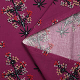 Cotton poplin printed with satellite flowers on a purple background