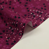 Cotton poplin printed with rustic romance on a purple background