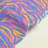 Cotton yellow and blue zebra print with pink background