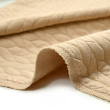 Matelassé jersey braids beige background