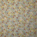 Mousseline nervurée imprimée fleurs rouge, bleu et jaune fond blanc