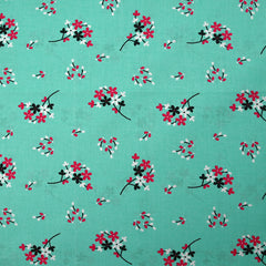 Popeline de coton imprimée souffle fleuri fond aqua