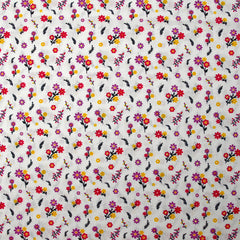 Popeline de coton imprimée un air de fleurs violet, jaune et framboise fond blanc