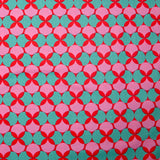Popeline enduite imprimée pois & trèfle vert fond rouge