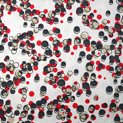 Satin de coton élasthanne dans les bulles rouge fond blanc
