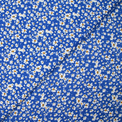 Viscose imprimée fleurs blanches et jaunes fond bleu